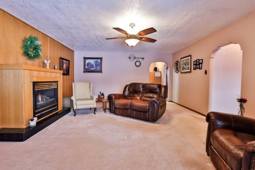1807 2 Avenue North, Lethbridge, AB - Indoor Photo Showing Living Room With Fireplace