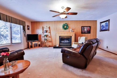1807 2 Avenue North, Lethbridge, AB - Indoor Photo Showing Living Room With Fireplace
