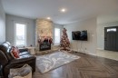 541 Aquitania Boulevard West, Lethbridge, AB  - Indoor Photo Showing Living Room With Fireplace 