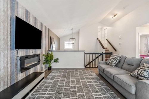 207 Moonlight Cove West, Lethbridge, AB - Indoor Photo Showing Living Room With Fireplace