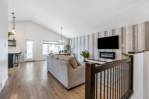 207 Moonlight Cove West, Lethbridge, AB - Indoor Photo Showing Living Room With Fireplace