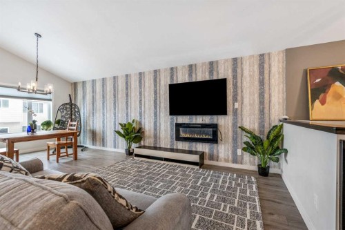 207 Moonlight Cove West, Lethbridge, AB - Indoor Photo Showing Living Room With Fireplace