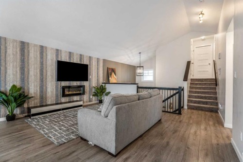 207 Moonlight Cove West, Lethbridge, AB - Indoor With Fireplace