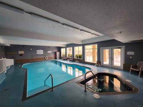 225-2020 32 Street South, Lethbridge, AB - Indoor Photo Showing Other Room With In Ground Pool