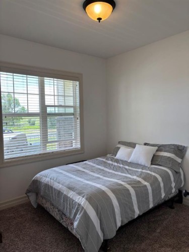 217 6 Avenue, Stirling, AB - Indoor Photo Showing Bedroom