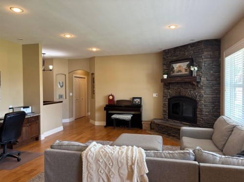 217 6 Avenue, Stirling, AB - Indoor Photo Showing Living Room With Fireplace