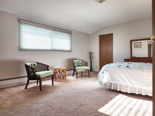 112 43 Avenue West, Claresholm, AB - Indoor Photo Showing Bedroom