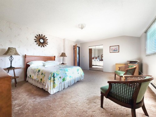 112 43 Avenue West, Claresholm, AB - Indoor Photo Showing Bedroom