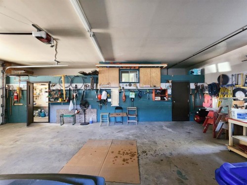 112 43 Avenue West, Claresholm, AB - Indoor Photo Showing Garage