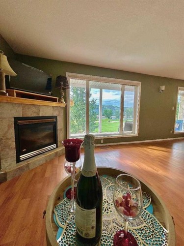 B-410 Canyon Boulevard West, Lethbridge, AB - Indoor Photo Showing Other Room With Fireplace
