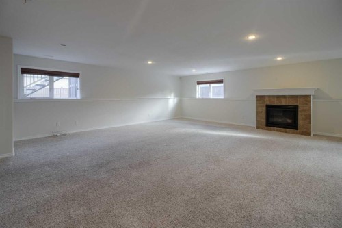 11 Cougar Cove North, Lethbridge, AB - Indoor With Fireplace