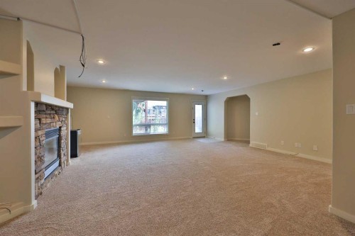 74 Rivermont Crescent West, Lethbridge, AB - Indoor Photo Showing Other Room With Fireplace