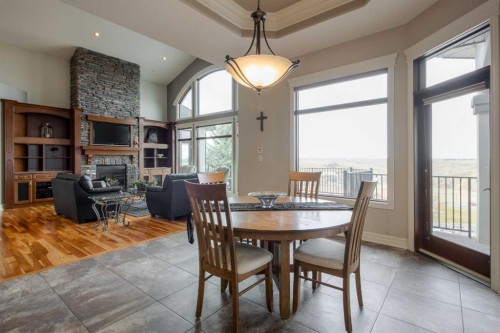 214 Sandstone Place South, Lethbridge, AB - Indoor Photo Showing Dining Room With Fireplace
