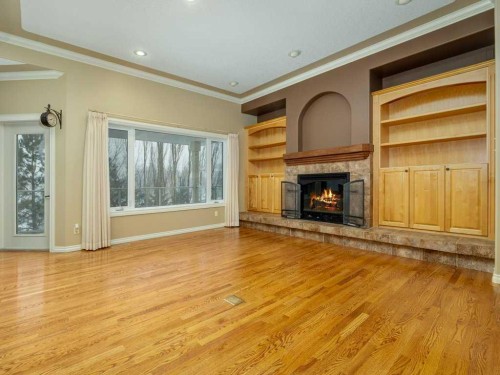 21 Fairmont Park Landing South, Lethbridge, AB - Indoor Photo Showing Living Room With Fireplace