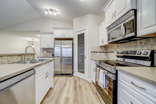 307 Sundance Drive, Coalhurst, AB - Indoor Photo Showing Kitchen With Double Sink With Upgraded Kitchen