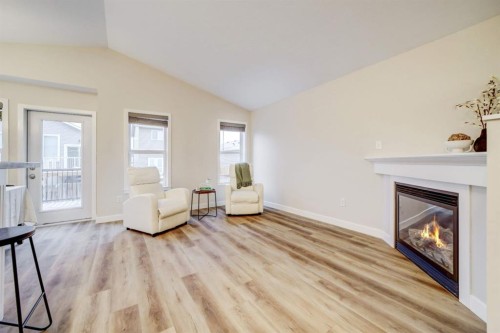 307 Sundance Drive, Coalhurst, AB - Indoor Photo Showing Living Room With Fireplace