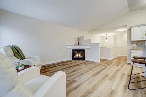 307 Sundance Drive, Coalhurst, AB - Indoor Photo Showing Living Room With Fireplace