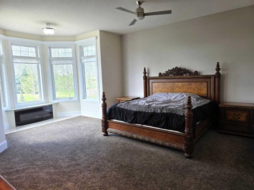 8 Grasslands Road, Rural Taber, M.D. Of, AB - Indoor Photo Showing Bedroom