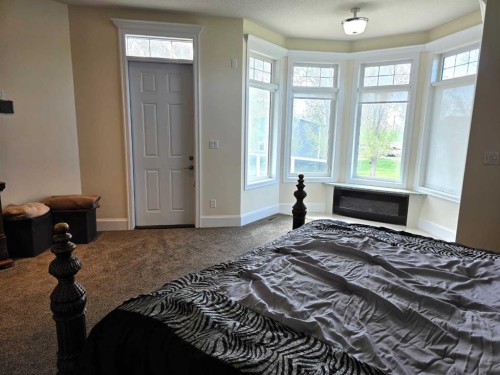 8 Grasslands Road, Rural Taber, M.D. Of, AB - Indoor Photo Showing Bedroom