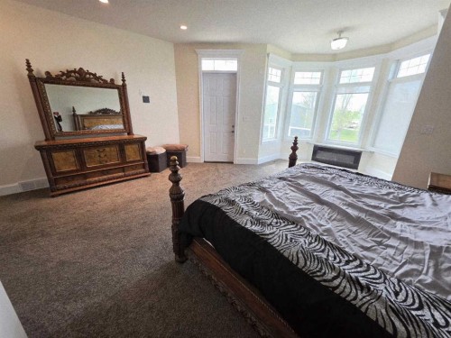 8 Grasslands Road, Rural Taber, M.D. Of, AB - Indoor Photo Showing Bedroom