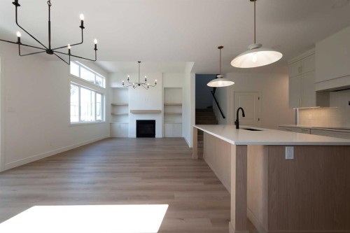 1664 Sixmile View South, Lethbridge, AB - Indoor Photo Showing Kitchen With Fireplace