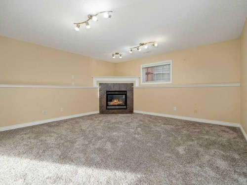 468 Heritage Boulevard West, Lethbridge, AB - Indoor With Fireplace