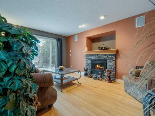 145 Canyon Close West, Lethbridge, AB - Indoor Photo Showing Living Room With Fireplace