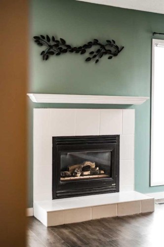 88 Cayuga Crescent West, Lethbridge, AB - Indoor Photo Showing Living Room With Fireplace