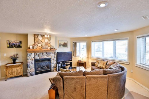 25 S 50 W, Raymond, AB - Indoor Photo Showing Living Room With Fireplace