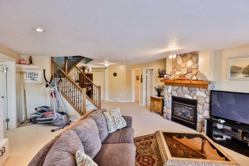 25 S 50 W, Raymond, AB - Indoor Photo Showing Living Room With Fireplace