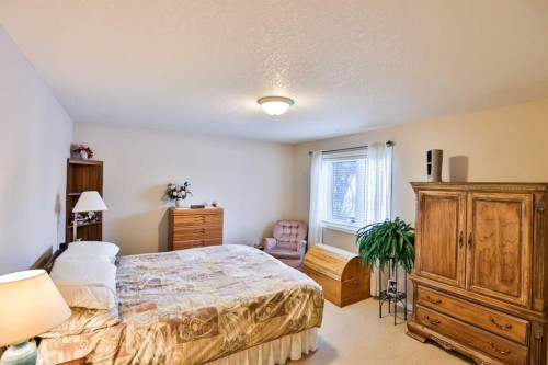 25 S 50 W, Raymond, AB - Indoor Photo Showing Bedroom