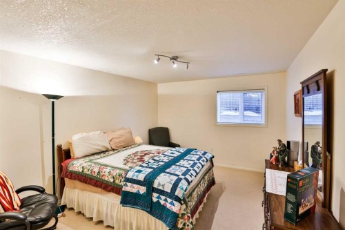 25 S 50 W, Raymond, AB - Indoor Photo Showing Bedroom