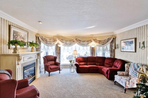 25 S 50 W, Raymond, AB - Indoor Photo Showing Living Room With Fireplace