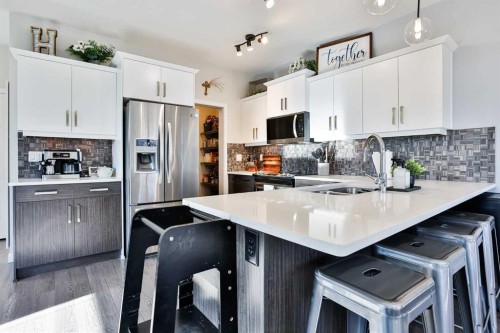 128 Cabot Landing West, Lethbridge, AB - Indoor Photo Showing Kitchen With Double Sink