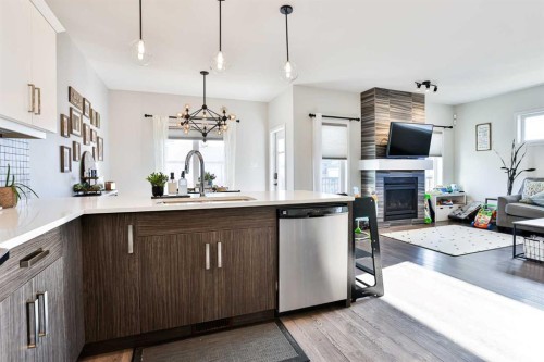 128 Cabot Landing West, Lethbridge, AB - Indoor Photo Showing Kitchen With Fireplace With Upgraded Kitchen