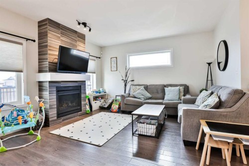 128 Cabot Landing West, Lethbridge, AB - Indoor Photo Showing Living Room With Fireplace