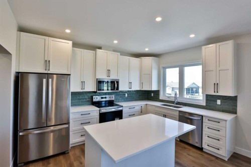 714 Fairways Drive, Vulcan, AB - Indoor Photo Showing Kitchen With Stainless Steel Kitchen With Double Sink With Upgraded Kitchen