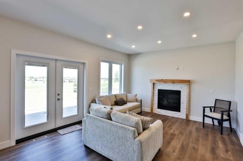 714 Fairways Drive, Vulcan, AB - Indoor Photo Showing Living Room With Fireplace