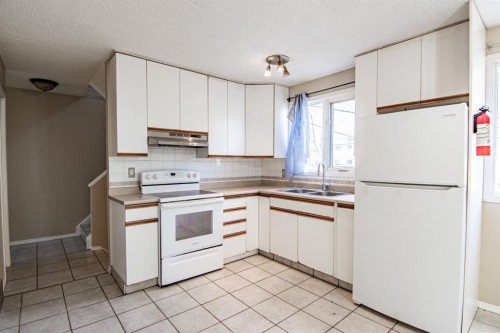 604 Terrace Park, Red Deer, AB - Indoor Photo Showing Kitchen With Double Sink