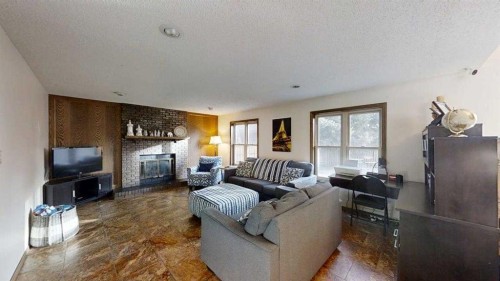 42 Ridgewood Boulevard West, Lethbridge, AB - Indoor Photo Showing Living Room With Fireplace