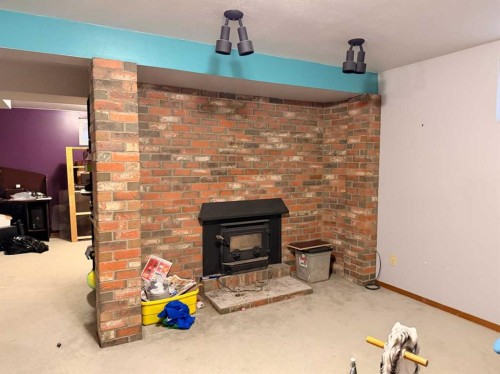 5214 38 Avenue, Taber, AB - Indoor With Fireplace