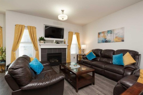 753 Twinriver Loop West, Lethbridge, AB - Indoor Photo Showing Living Room With Fireplace