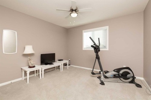 753 Twinriver Loop West, Lethbridge, AB - Indoor Photo Showing Gym Room