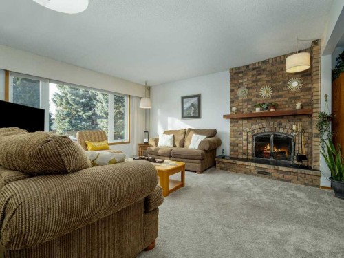 2017 16 Street North, Lethbridge, AB - Indoor Photo Showing Living Room With Fireplace