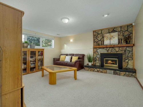 2017 16 Street North, Lethbridge, AB - Indoor Photo Showing Living Room With Fireplace