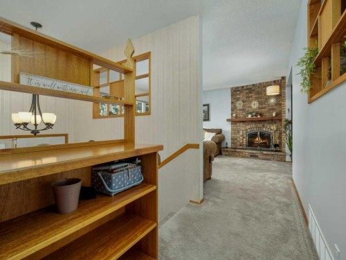 2017 16 Street North, Lethbridge, AB - Indoor Photo Showing Other Room With Fireplace