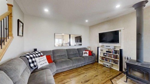 62072 Range Rd 215, Welling, AB - Indoor Photo Showing Living Room With Fireplace