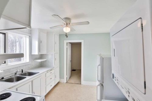236 N 100 W, Raymond, AB - Indoor Photo Showing Kitchen With Double Sink