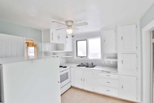 236 N 100 W, Raymond, AB - Indoor Photo Showing Kitchen With Double Sink