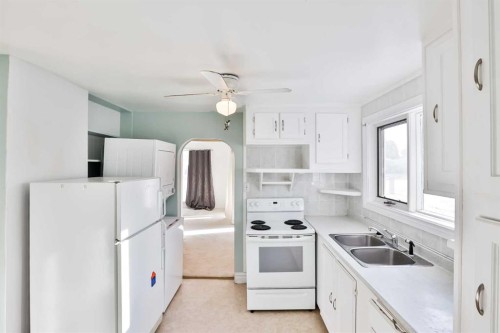 236 N 100 W, Raymond, AB - Indoor Photo Showing Kitchen With Double Sink